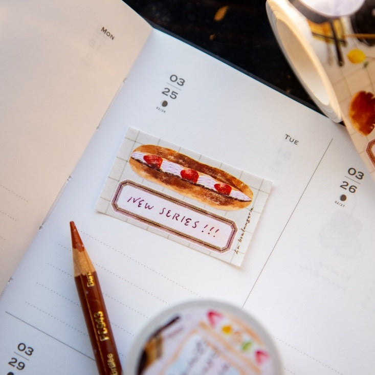 Sweet Hours Label Sticker Tape by OURS Studio — hot-dog 'New Series' label sticker on a desk, for journaling