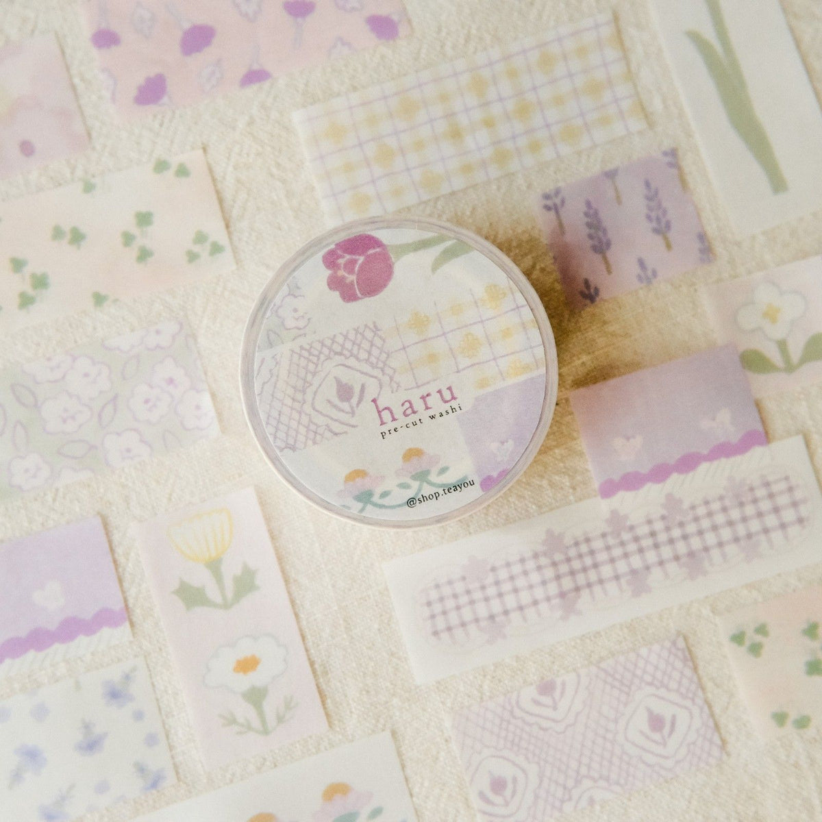 Round container with floral design on a patchwork background