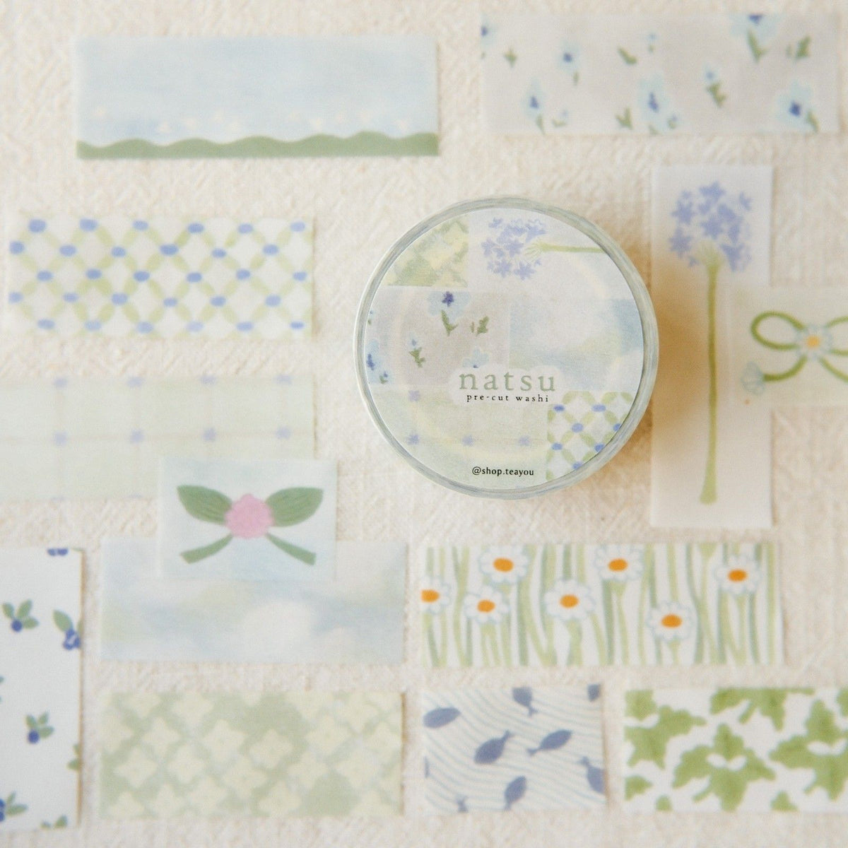 Set of washi tape with various designs on a textured background