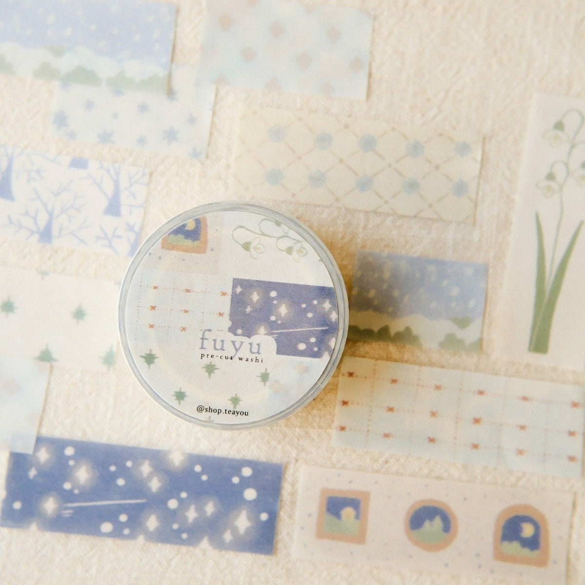 Washi tape with 'fuyu' branding on a textured fabric background