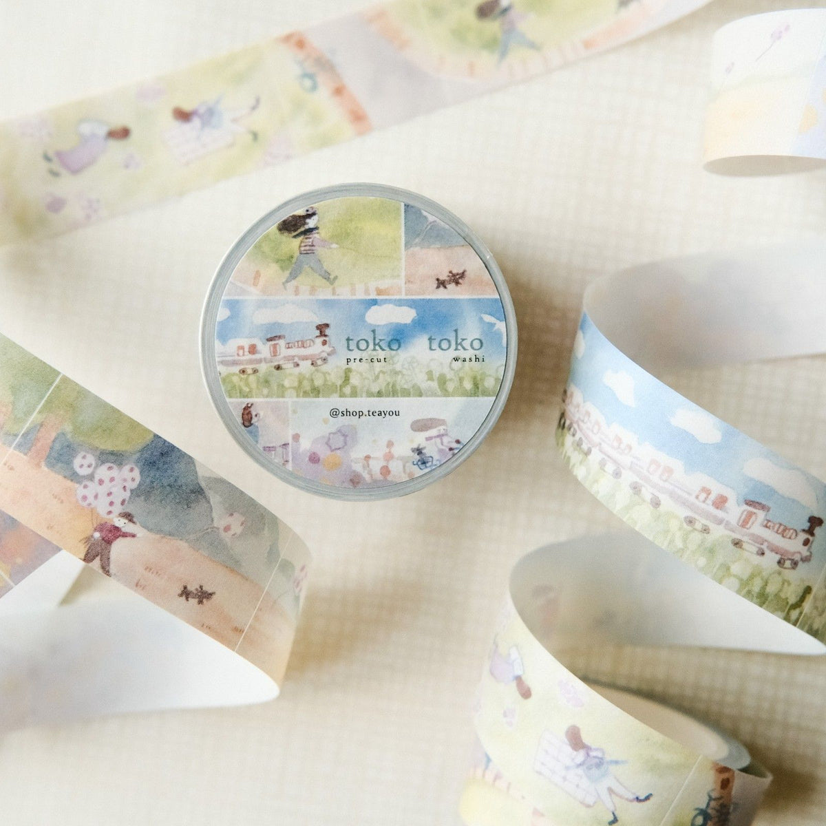 Washi tape with scenic designs and 'toko toko' branding on a light background