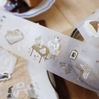 Sheet of decorative stickers with illustrations on a white surface.