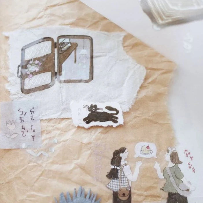 Artistic depiction of a black cat, two people, and a cake on crumpled paper with a belt buckle.