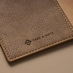 Kurumi Planner PU Cover by Take a Note — close-up of the wood-tone PU with embossed logo, for journaling
