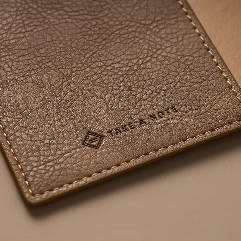 Kurumi Planner PU Cover by Take a Note — close-up of the wood-tone PU with embossed logo, for journaling