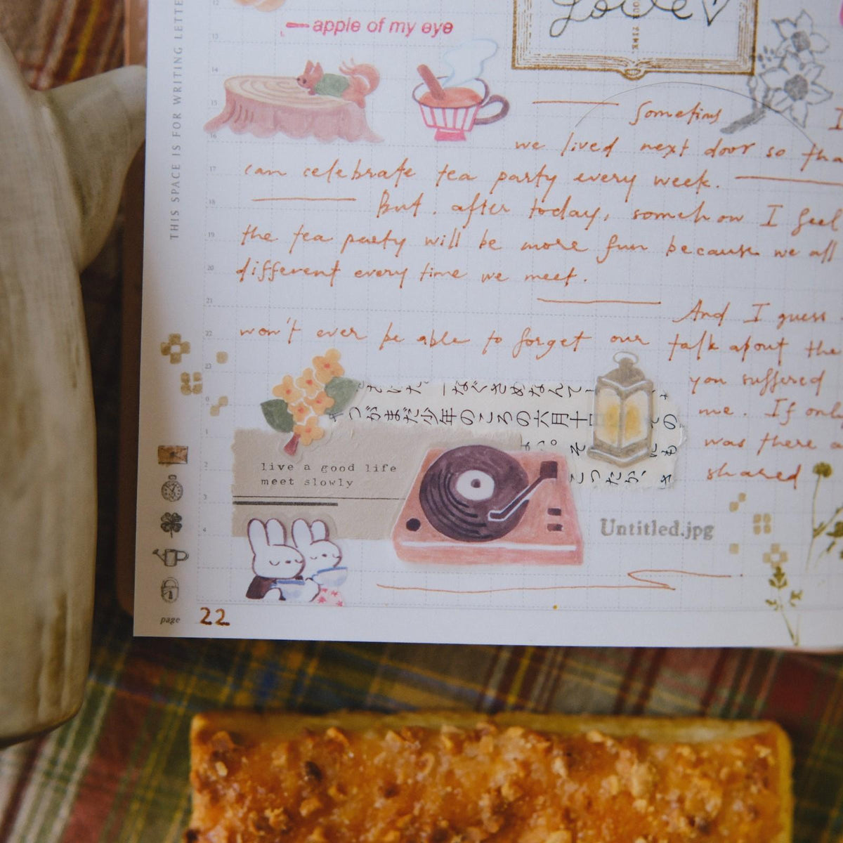 Sheet of paper with handwritten text and illustrations on a textured surface