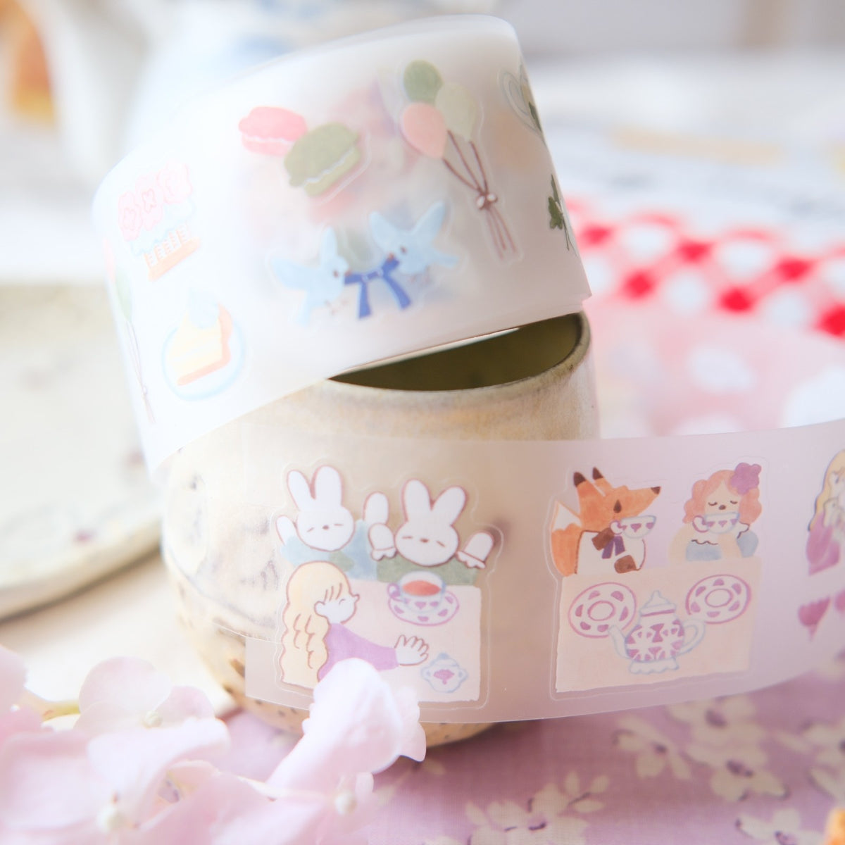 Decorative tape with cartoon designs on a pink surface