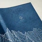 Reverberation Tyvek Book Cover by Take a Note — close-up of the mountain line art and logo, for journaling
