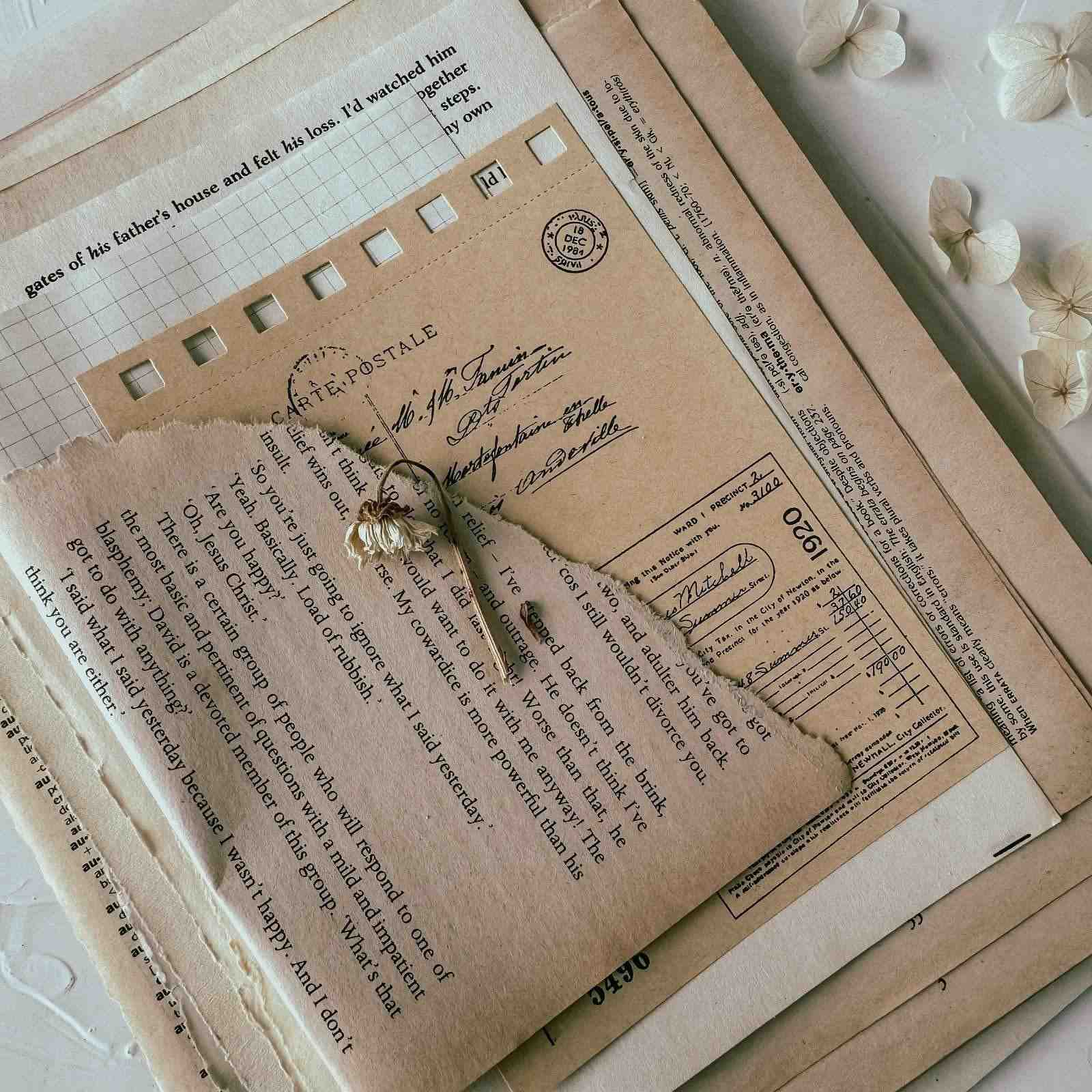 Vintage-style letter with floral elements on a textured surface